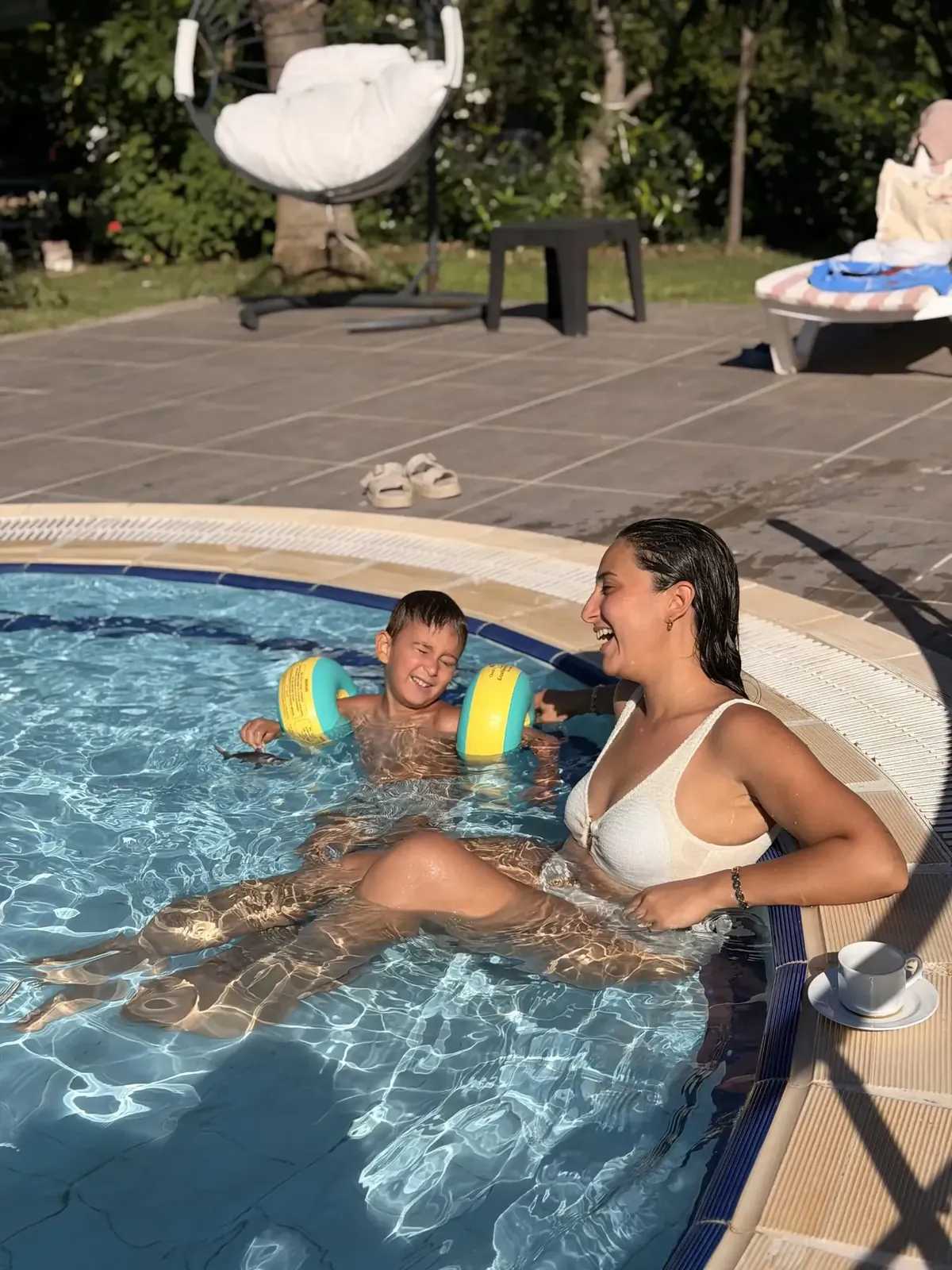 The hotel's swimming pool and sun loungers